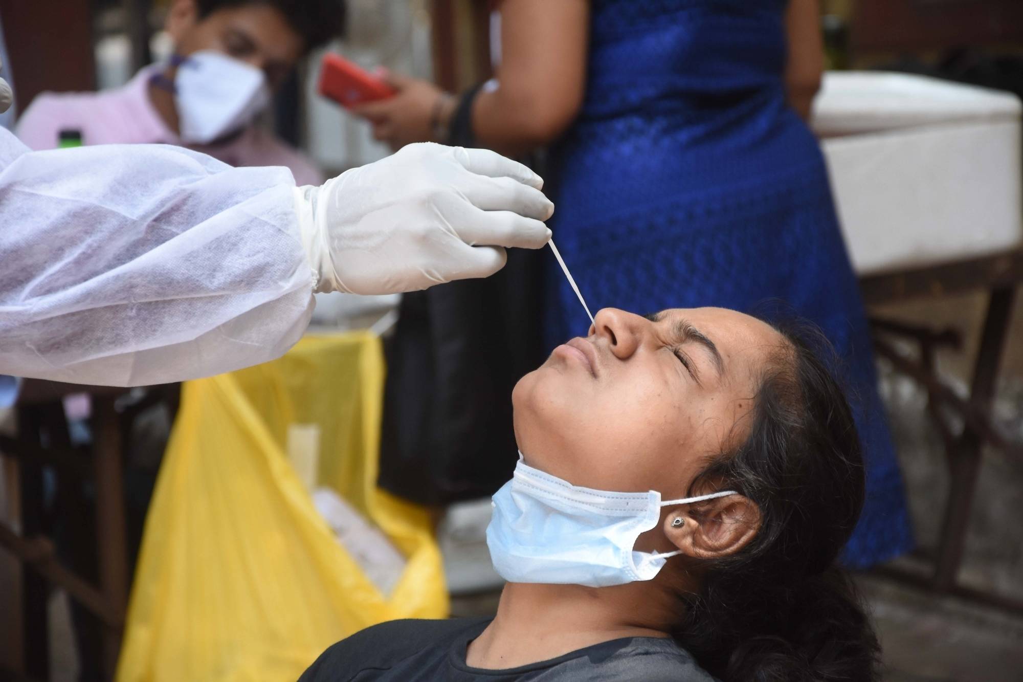 Mumbai: State Government all over Maharashtra people have told “Mask wear compulsory and protect your life” but see this health worker no care without mask enjoying call at Dadar in Mumbai on Wednesday April 07, 2021.(Photo:Sandeep Mahankal/IANS)