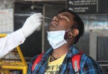 New Delhi: Health worker collect swab sample for Covid-19 testing at New Delhi railway station in New Delhi on Thursday, 20 May, 2021(Photo: Wasim Sarvar/IANS)