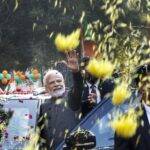New Delhi: Flowers being showered on Prime Minister Narendra Modi as he waves to supporters during a roadshow before the BJP national executive meeting, in New Delhi, Monday, January 16, 2023. (Photo: Wasim Sarvar/IANS)