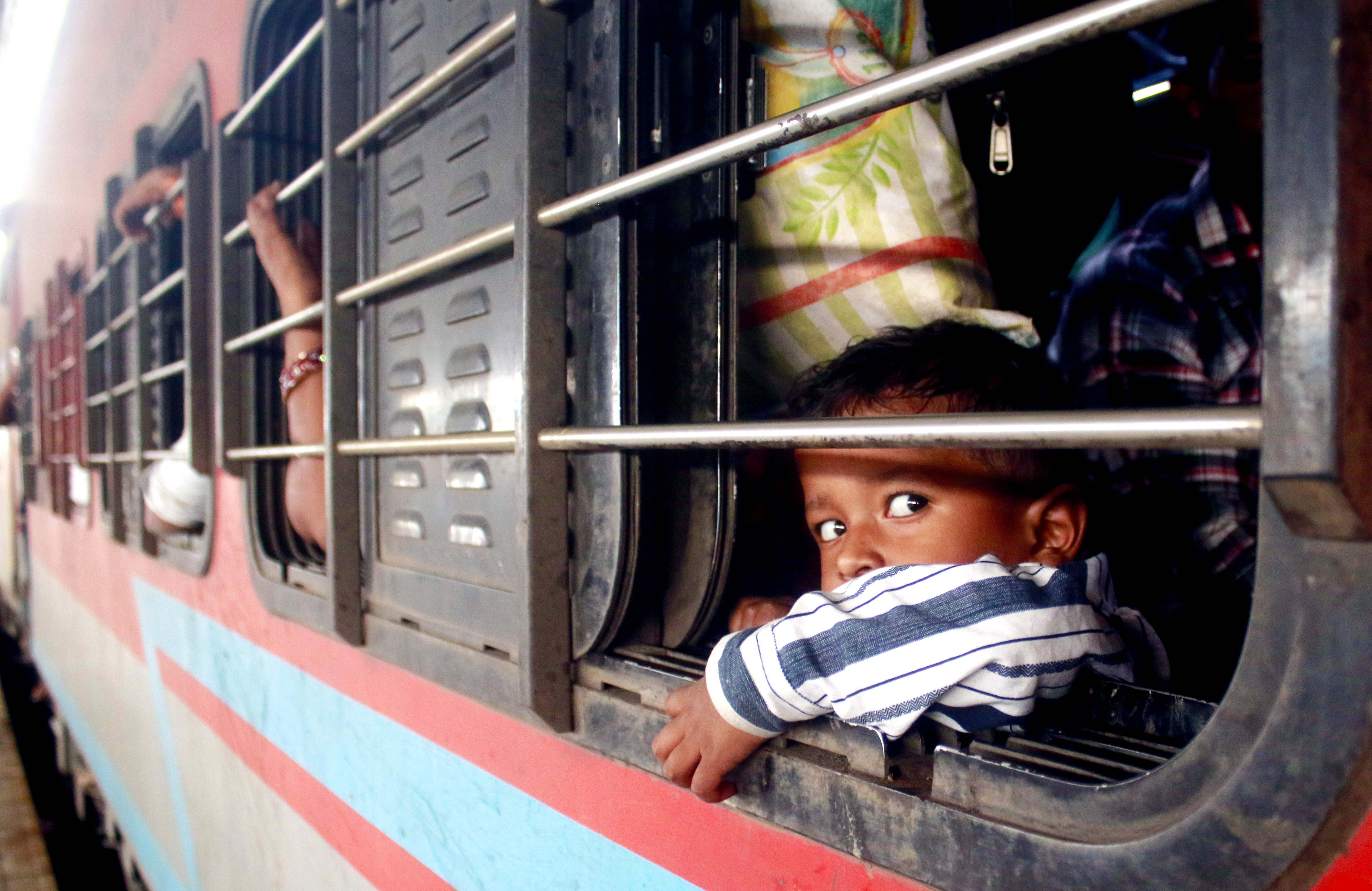 New Delhi: Passengers board a train at Anand Vihar Railway Station to travel to their native places for the Chhath Puja festival