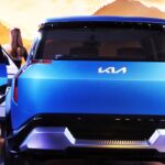 Greater Noida: A model poses with a concept car by Kia at the Auto Expo 2023, in Greater Noida, Uttar Pradesh on Thursday, January 12, 2023. (Photo: Anupam Gautam/IANS)